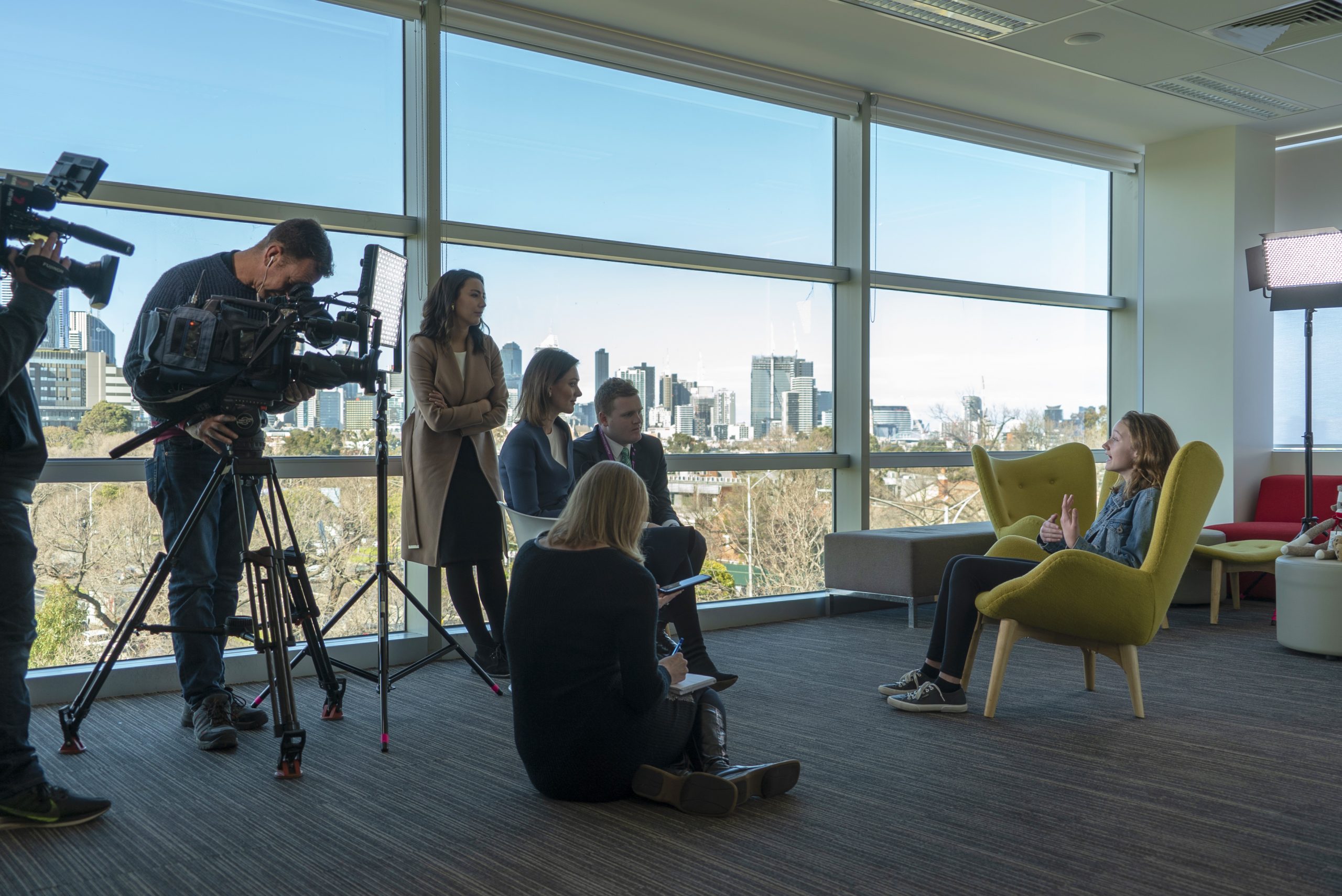 Participant Sian speaks to TV crews about her experiences with stuttering. 